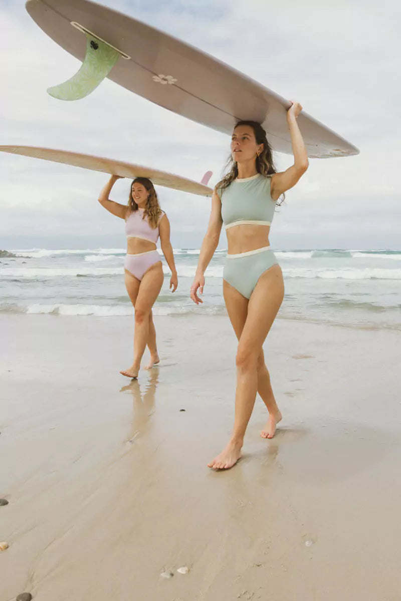 female surfers are about to surf in new collection bikini top and bottom from ninefootstudio