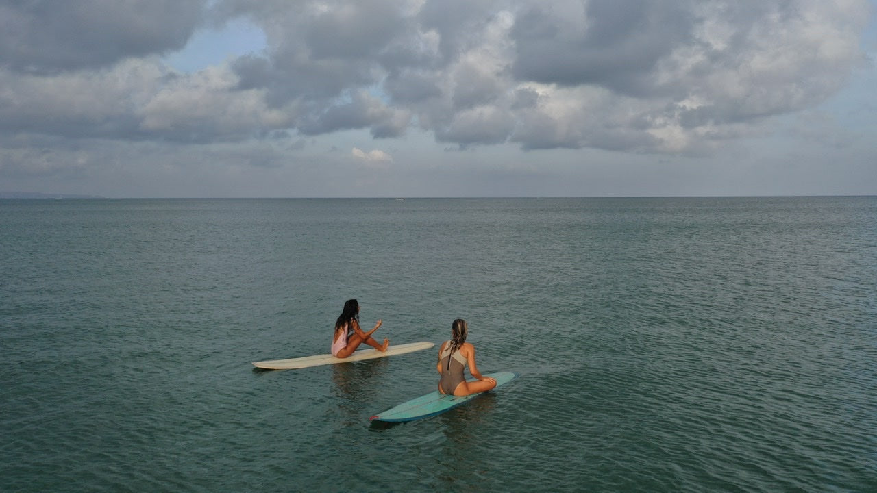 Surfing longboard in surf retreat in Bali