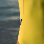krui onepiece surf swimsuit in beat (yellow) color back side asymetrical