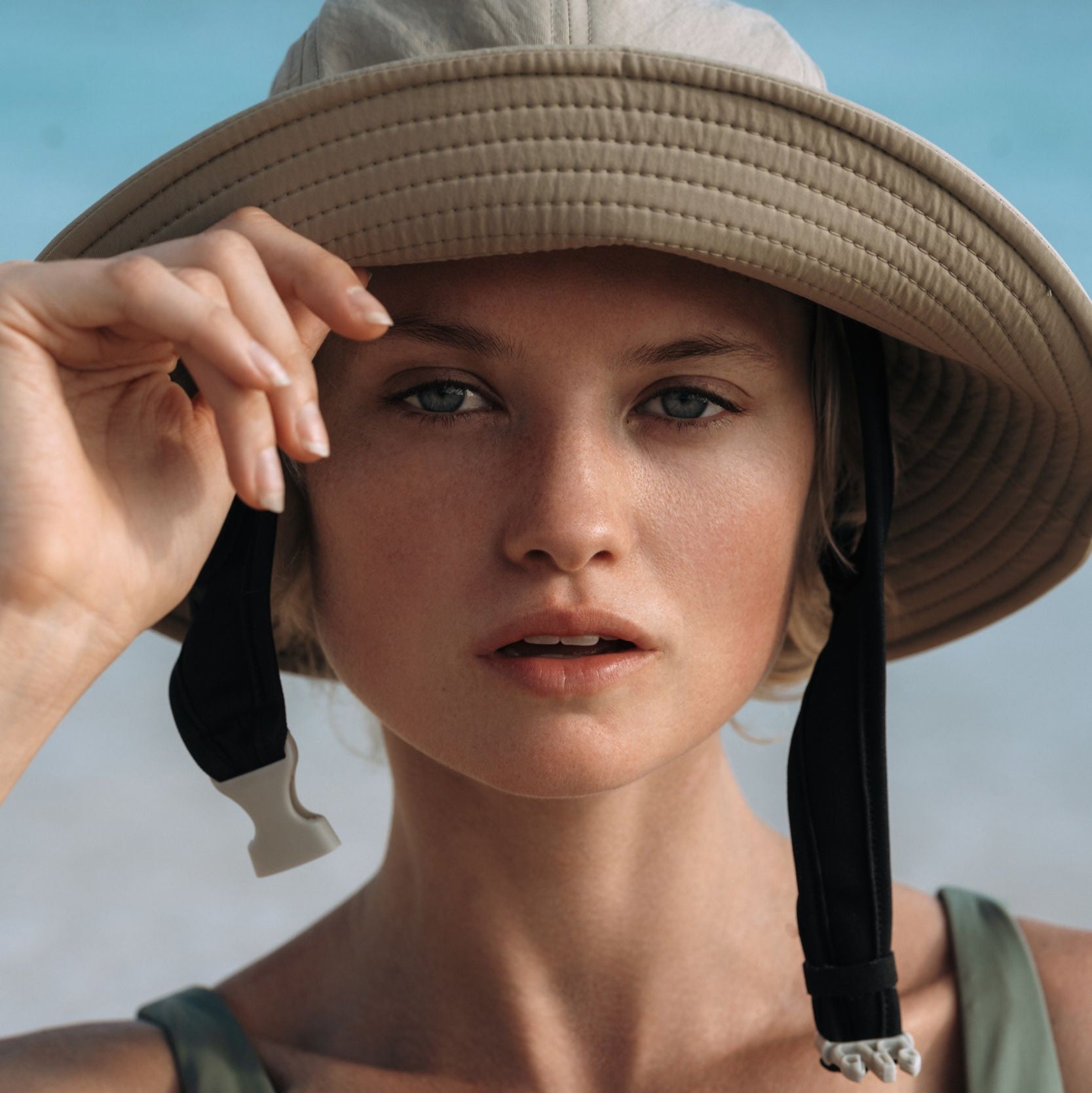 Ninefoot Studio Jade Surf Hat in Army Green color with adjustable strap