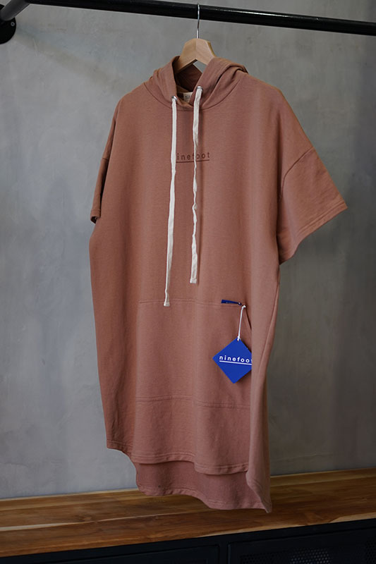 nico surf poncho with hoodie in latte color store display