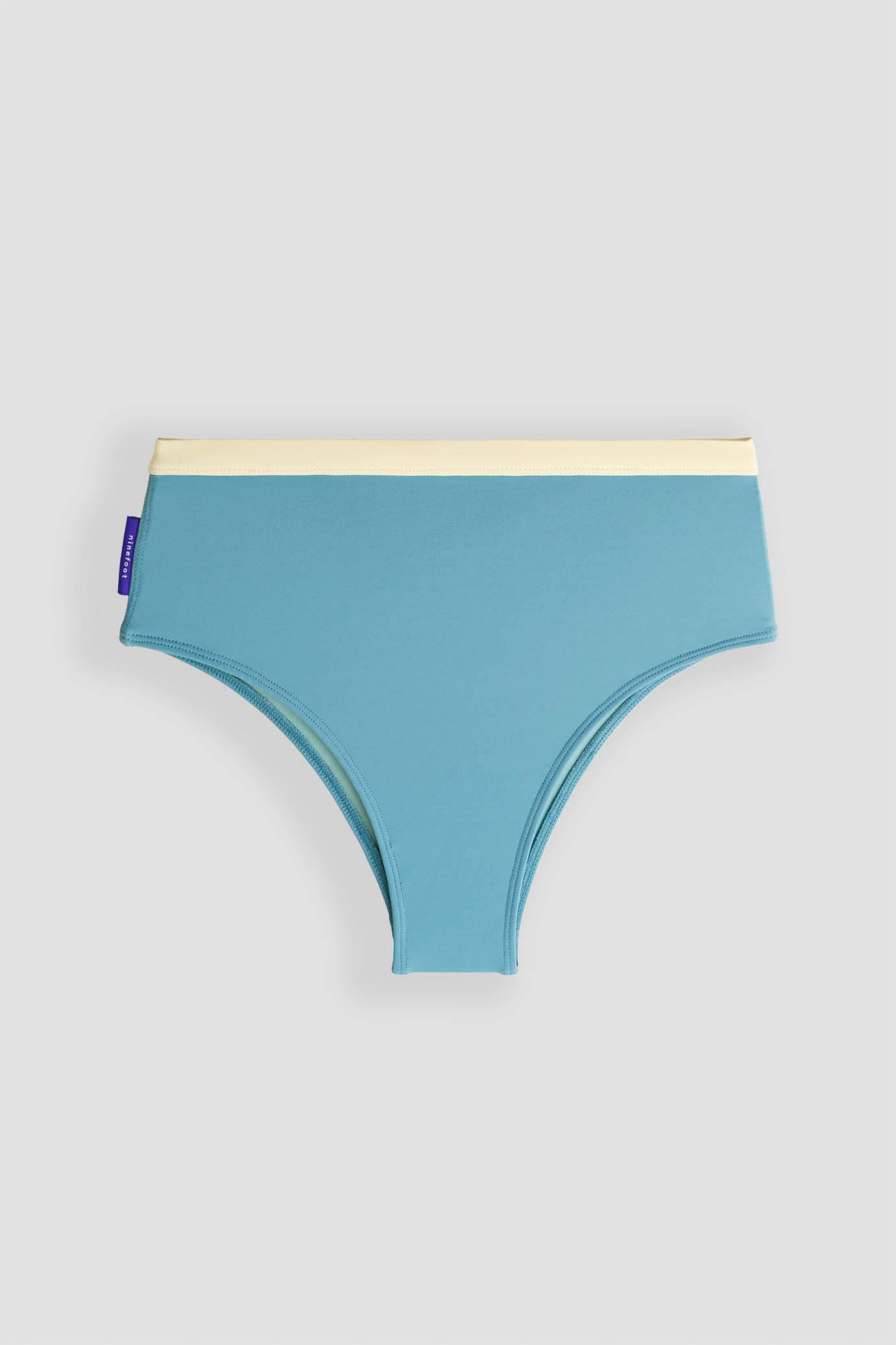 rote surf bikini bottom in stone blue color flat photo front side